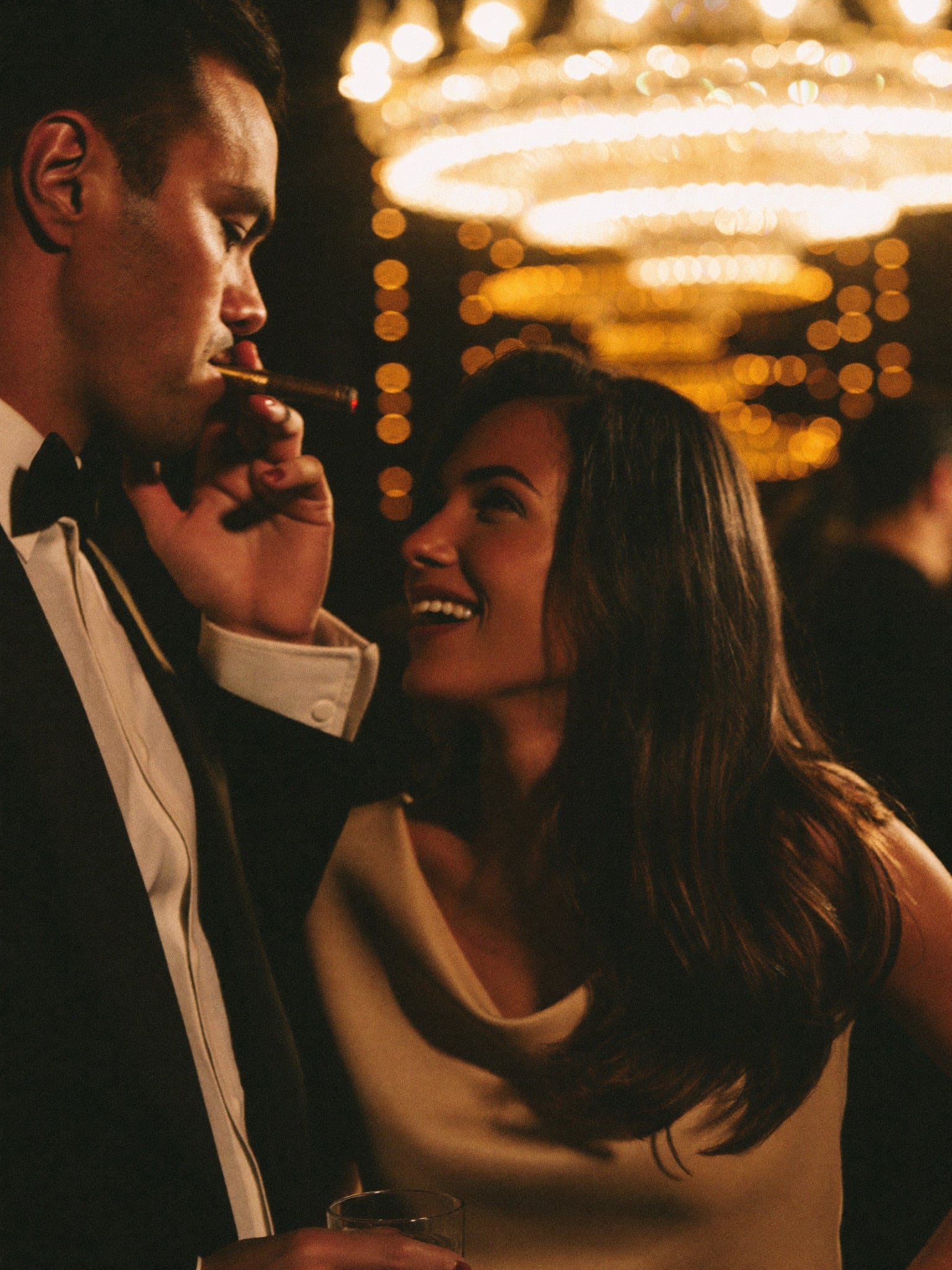 Couple enjoying cigars and conversation at the event